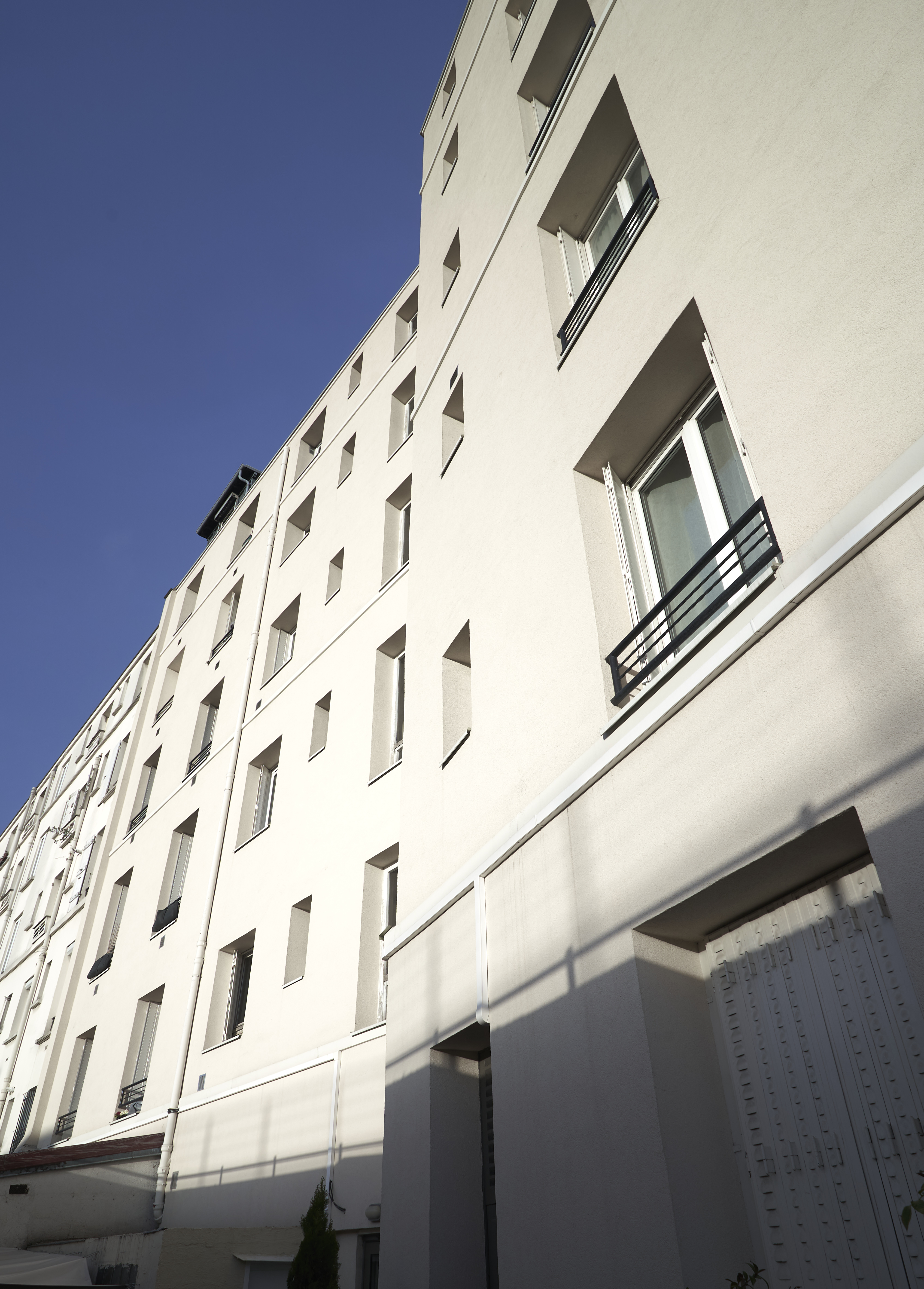 Façade sur cour isolée par l'extérieur d'un immeuble Huassmannien 