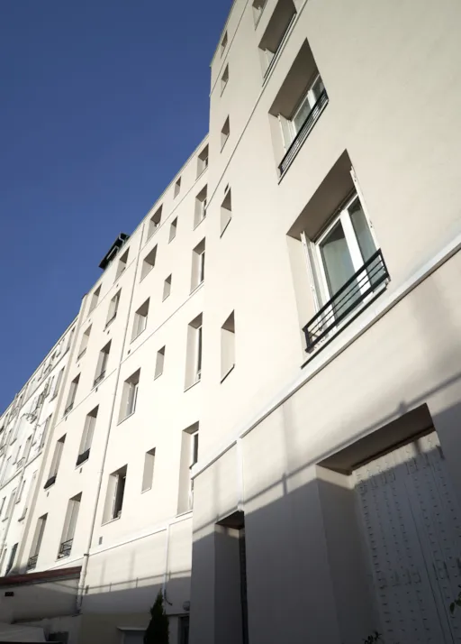 Façade sur cour isolée par l'extérieur d'un immeuble Huassmannien